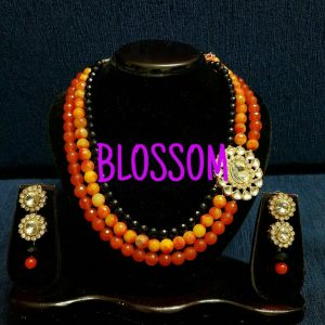 Semi Precious layers of orange pearls.