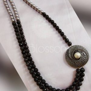 Semi precious black pearls with oxidised broach