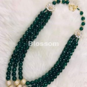 Semi precious pearls with AD brass peices in centre