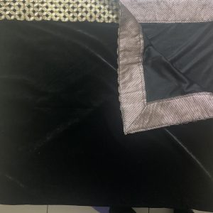 Black velvet shawl with broad border.