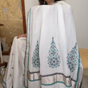 Kerala kasavu with silver zari, block printing and kasuti hand embroidery with mirrors in it.